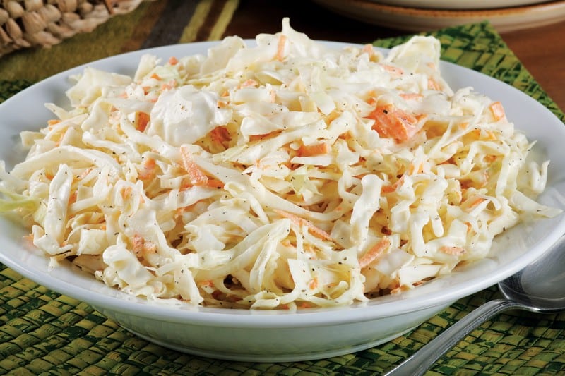 Coleslaw in White Bowl on Green Placemat Food Picture