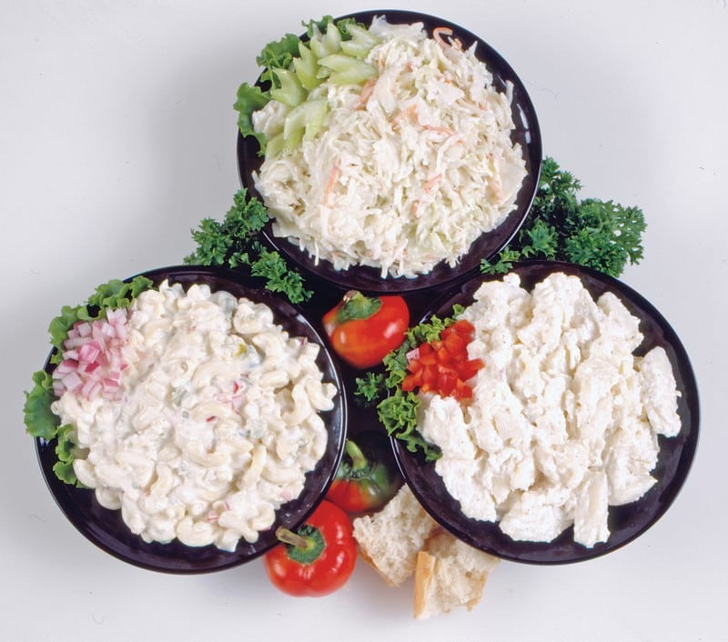 Assorted Deli Salads in Black Bowls Food Picture