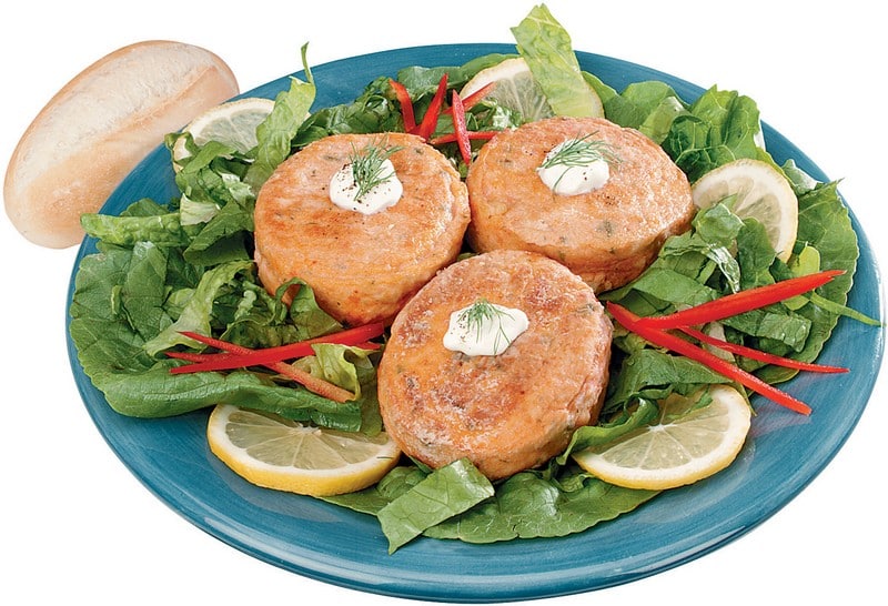 Salmon Burger over Greens with Garnish on Blue Dish Food Picture