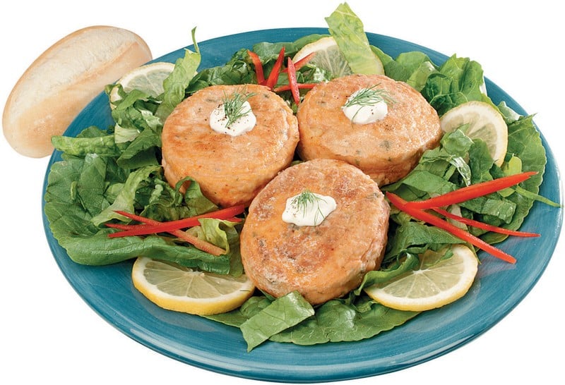 Salmon Burgers with Lettuce and Lemons on Blue Plate Food Picture