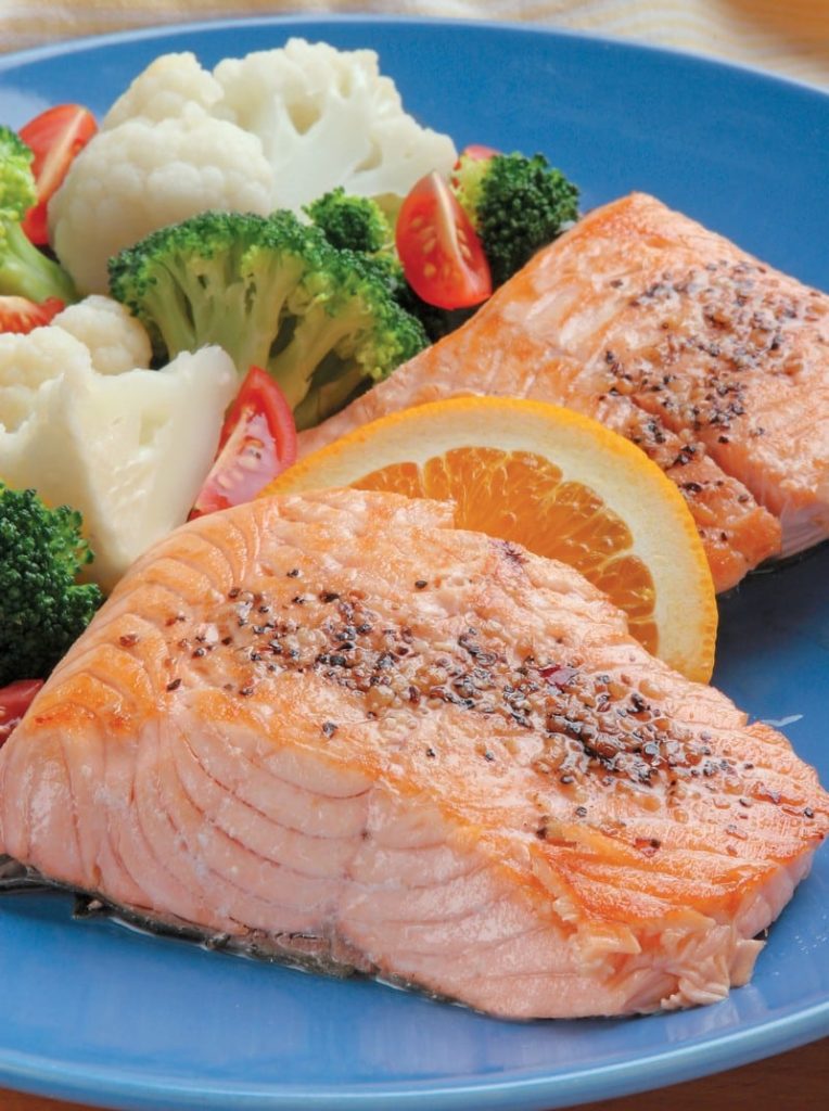 Crusted Salmon Fillet with Veggies on Blue Plate Food Picture