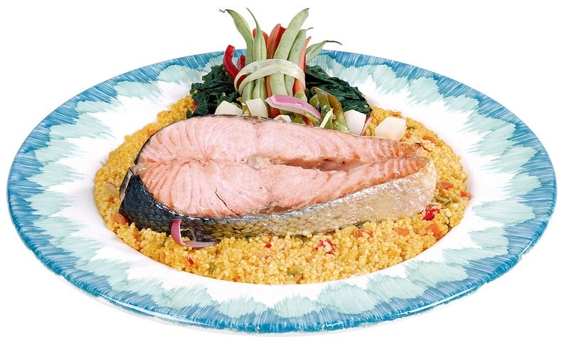 Salmon Steak over Rice with Garnish on Blue and White Plate Food Picture