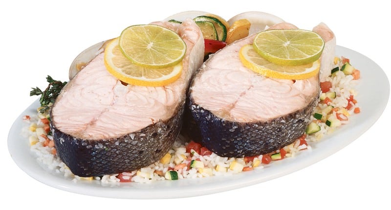 Salmon Steak over Rice and Veggies with Garnish Food Picture