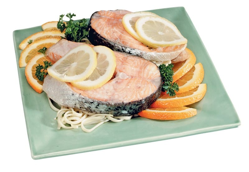Salmon Steak over Orange Slices and Pasta with Garnish Food Picture