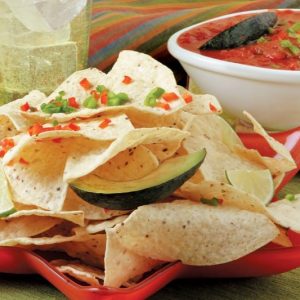 Chips and Salsa with Garnish on Red Plate and Dipping Sauce Food Picture