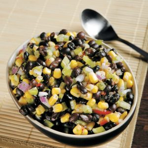 Corn and Black Bean Sala in Black Bowl with Spoon Food Picture