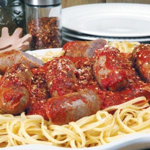 Sausage over Pasta in White Dish Food Picture