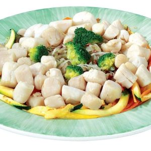Bay Scallops over Veggies on Green and White Plate Food Picture