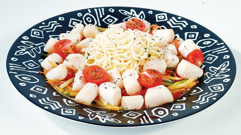 Bay Scallops over Veggies with Pasta on Black and White Plate Food Picture