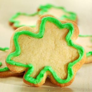 Shamrock Shaped Cookies with Green Icing on Table Food Picture