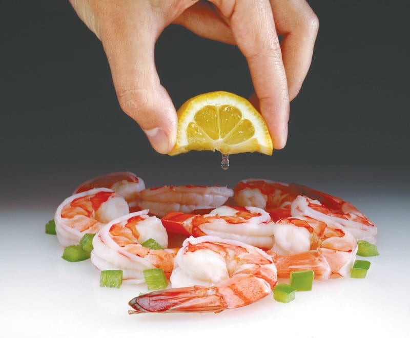 Shrimp and Green Peppers with Lemon Squeezed over Food Picture