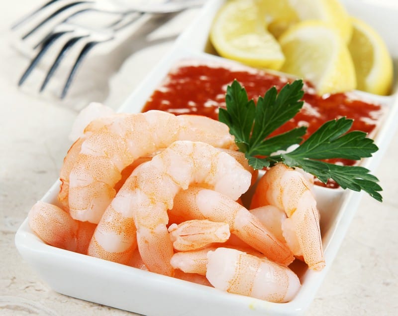 Shrimp Cocktail with Cocktail Sauce and Lemon Food Picture