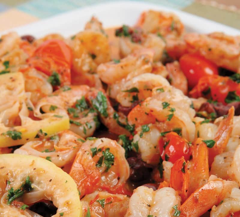 Close Up of Shrimp Scampi with Lemons and Tomatoes Food Picture