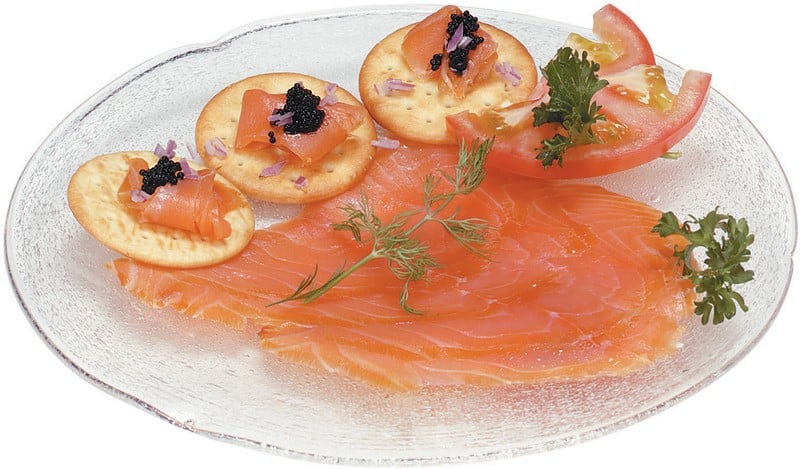 Smoked Salmon on Clear Plate with Crackers and Tomatoes Food Picture