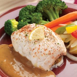 Baked Stuffed Sole with Veggies and Sauce on Red Plate Food Picture
