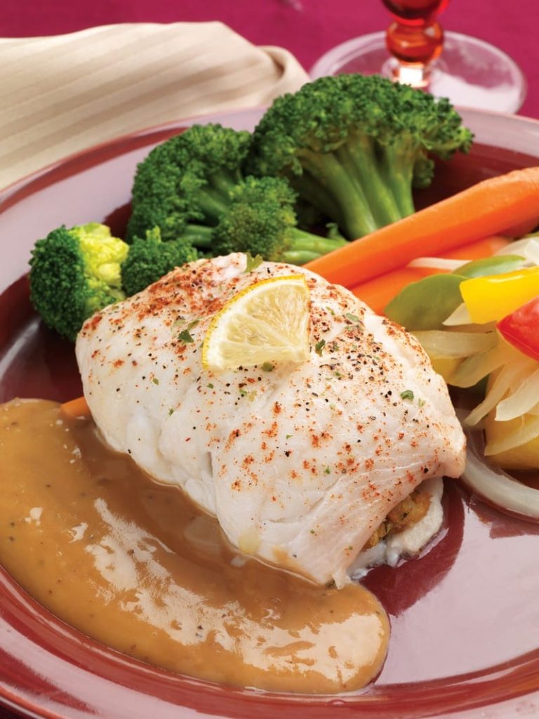 Baked Stuffed Sole with Veggies and Sauce on Red Plate Food Picture