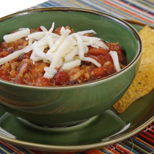 Bowl of Chili with Cheese and Tortilla Chips Food Picture
