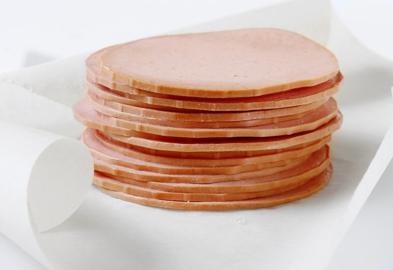 Thick Sliced Deli Fresh Bologna on Wax Wrapping Paper Food Picture
