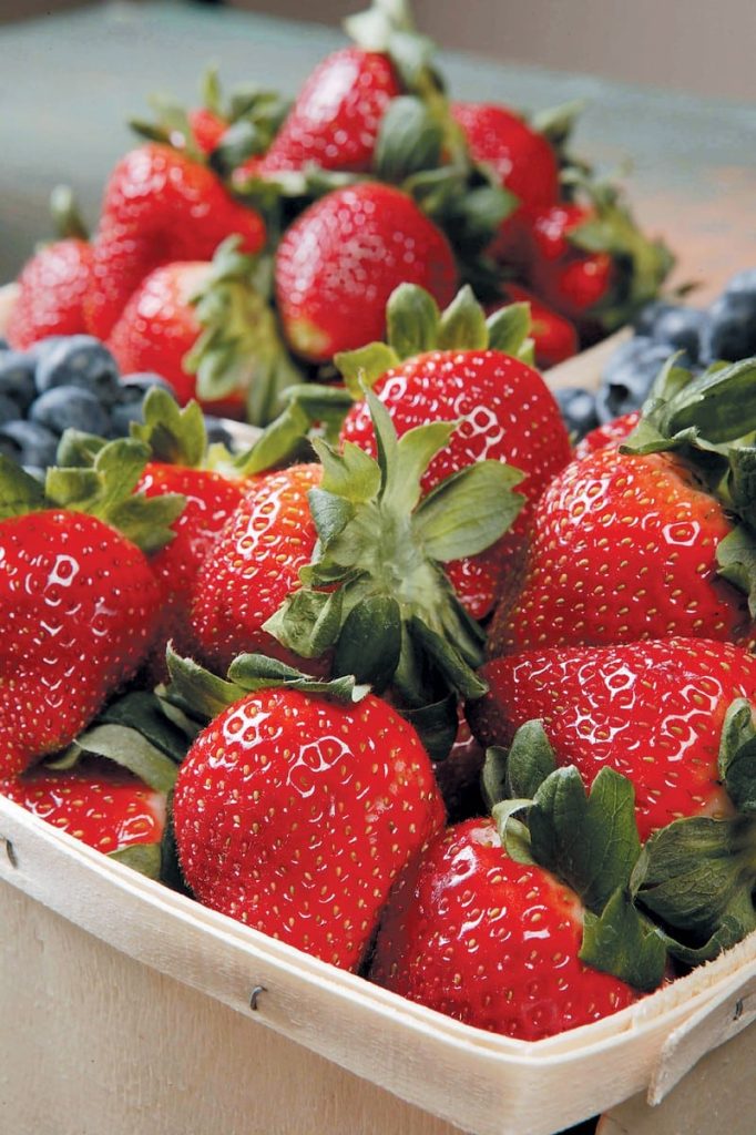Box of Fresh Strawberries with Blueberries on Table Food Picture