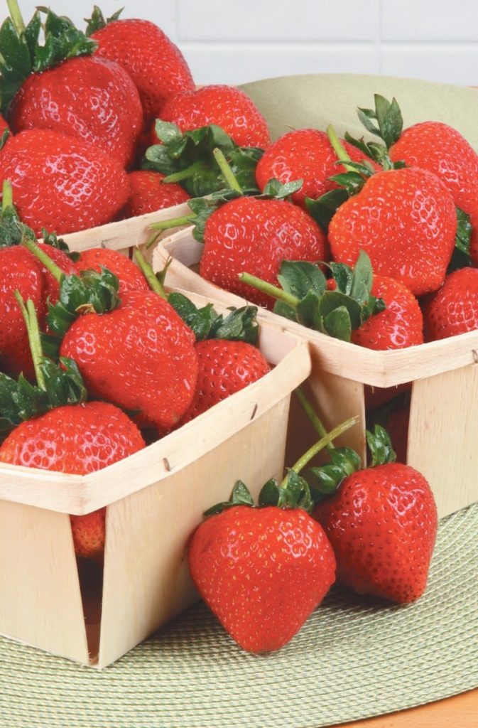 Boxes of Long Stem Strawberries on Table Food Picture