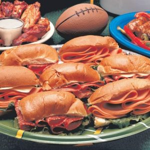 Superbowl Sandwiches and Assorted Snacks on Football Plate Food Picture