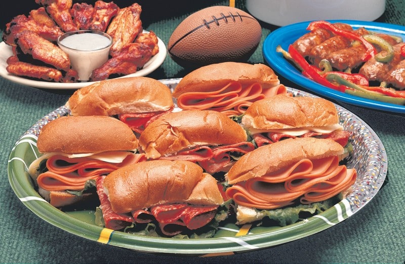 Superbowl Sandwiches and Assorted Snacks on Football Plate Food Picture