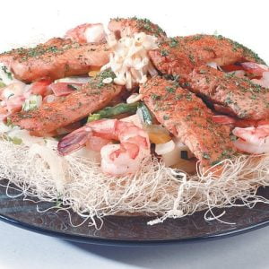 Surf and Turf over Rice Noodles in Black Dish Food Picture