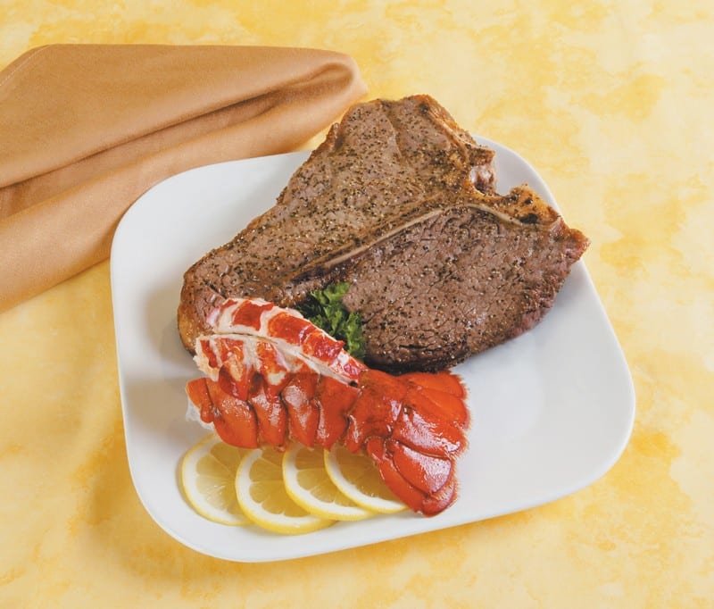 Surf and Turf on White Plate with Lemon Food Picture