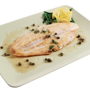 Baked swai fish with capers and garnish on light colored plate with white background Food Picture