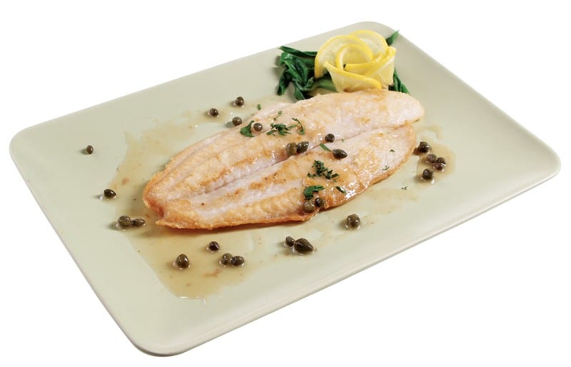 Baked swai fish with capers and garnish on light colored plate with white background Food Picture
