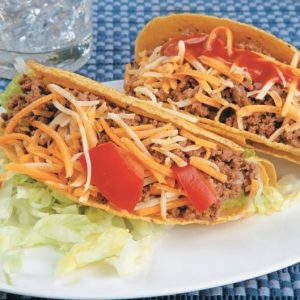 Tacos on White Plate and Blue Placemat Food Picture