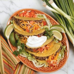 Tacos in Orange Dish on Marble Surface Food Picture