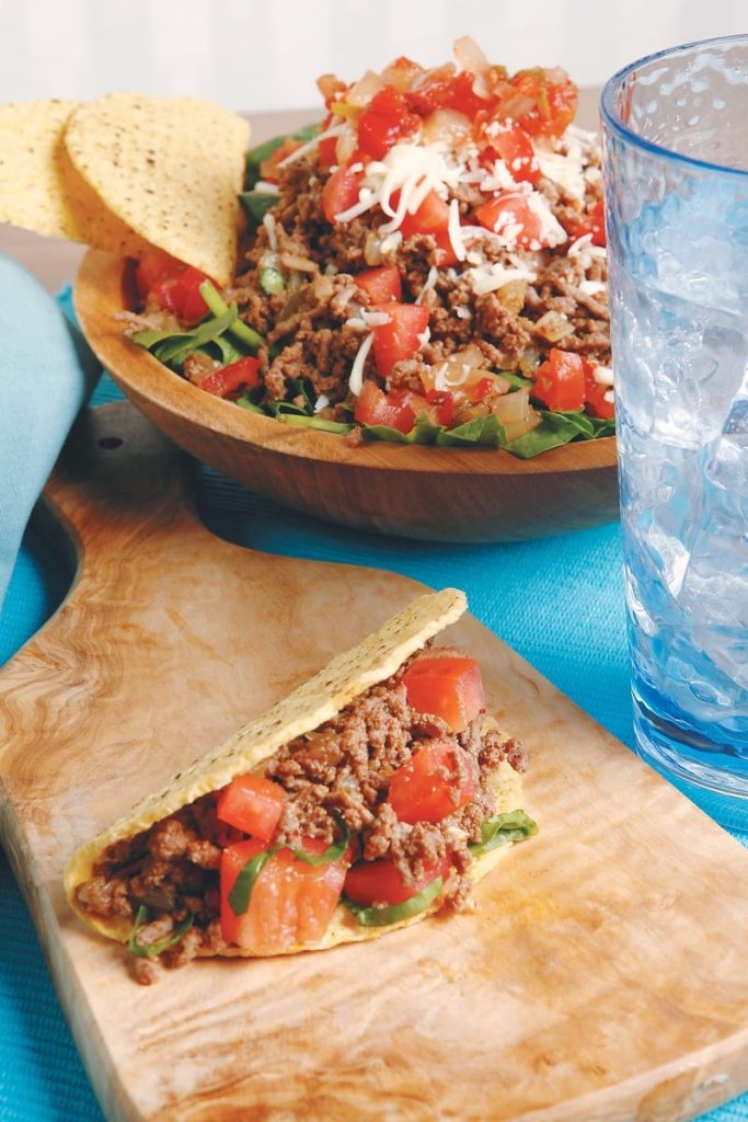 Taco Salad with Shells on Blue Tablecloth Food Picture