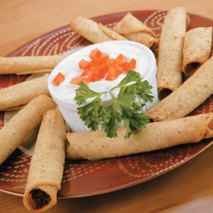Taquitos on Decorative Plate with Dipping Sauce Food Picture