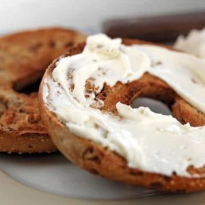 Fresh Toasted Bagel with Cream Cheese on Plate Food Picture