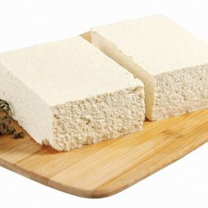 Two Tofu Bricks on Wooden Slab Food Picture