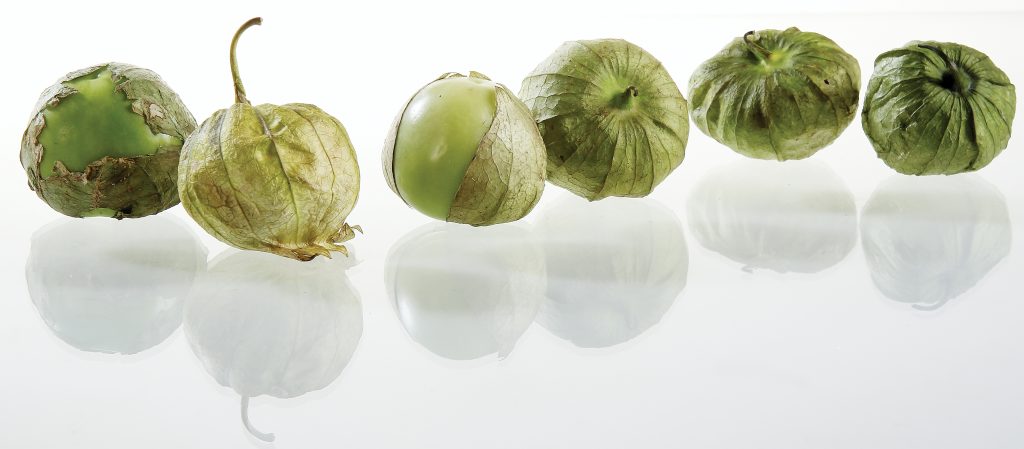 Tomatillos on White Surface Food Picture
