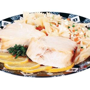 Tuna steak with pasta and garnish on dark blue and white plate Food Picture