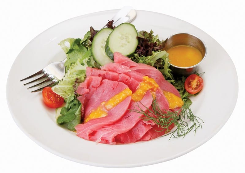 Yellowfin tuna with salad and dressing on white plate with white background Food Picture