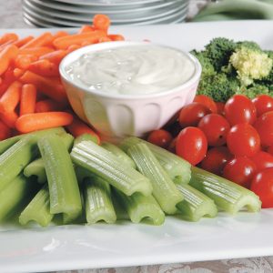 Vegetable Tray with Dip with Plates in Back Food Picture