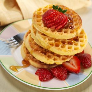 Stack of Waffles with Strawberries and Syrup Food Picture