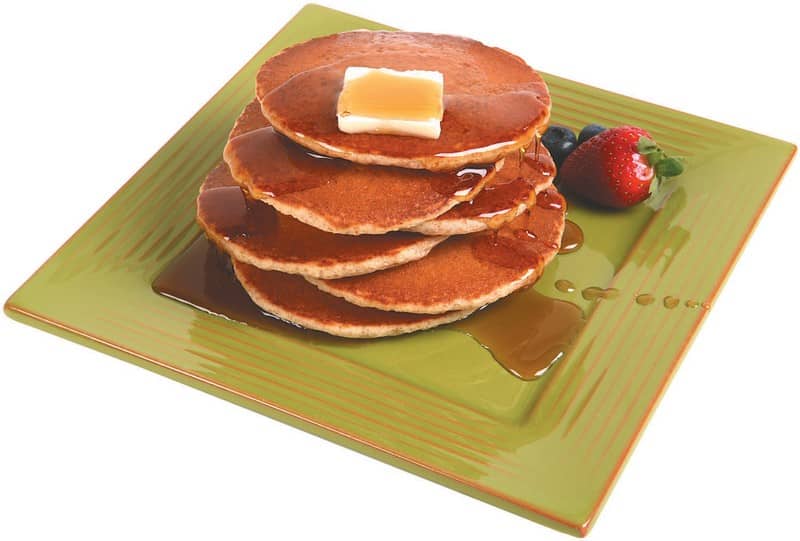Wheat Pancakes with Syrup on a Green Plate Food Picture