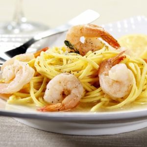 Peppered White Shrimp on Spaghetti with Lemon Wedge and Garlic Butter Sauce Food Picture