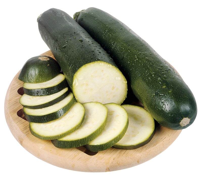 Whole and Sliced Zucchini on Cutting Board Food Picture