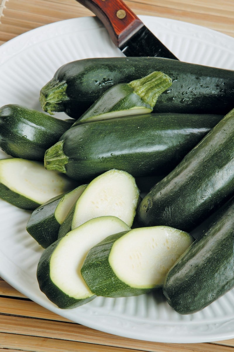 Sliced and Whole Zucchini on Plate Food Picture