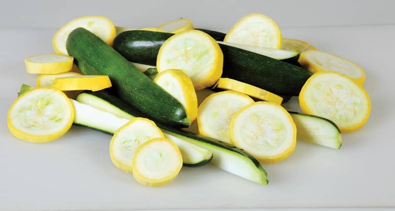 Sliced Zucchini and Summer Squash on White Surface Food Picture